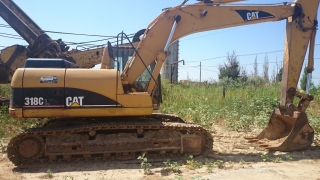 Экскаватор гусеничный Caterpillar 318 CL купить в компании Рабочие Машины
