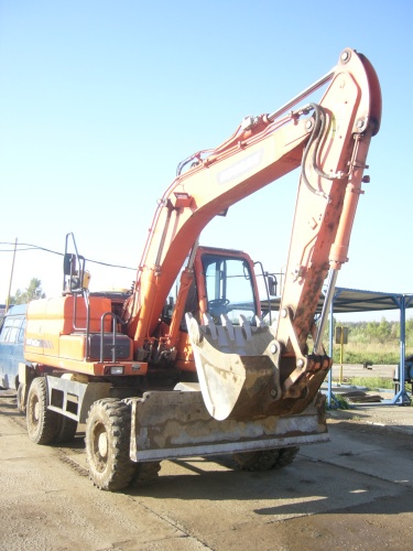 экскаватор колесный DOOSAN 140 W купить в компании Рабочие Машины