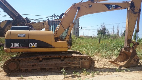 Экскаватор гусеничный Caterpillar 318 CL купить в компании Рабочие Машины