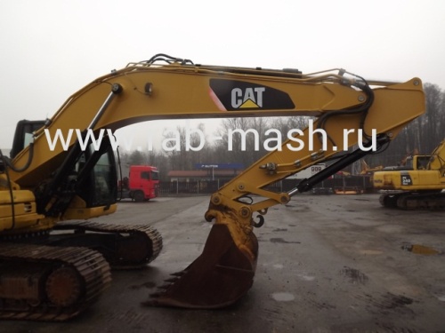 Экскаватор гусеничный Caterpillar 323 DL купить в компании Рабочие Машины